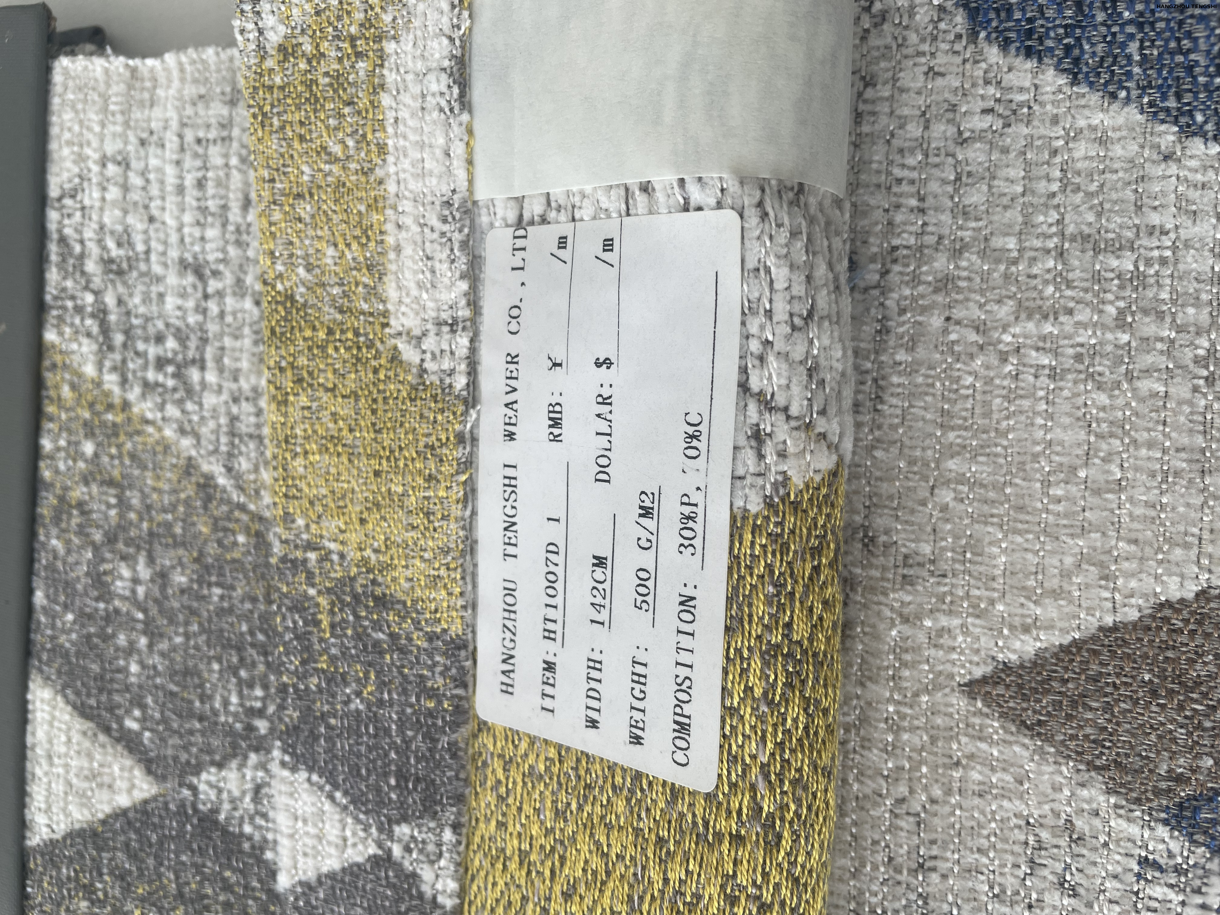 Textile manufacturing facility showing woven fabric production line